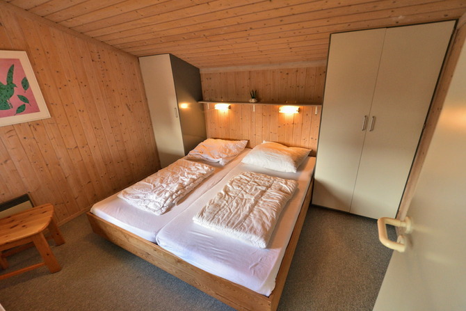 Ferienhaus in Pelzerhaken - Ferienhaus Typ B im Ferienpark AM WALDRAND - Schlafzimmer mit Doppelbett