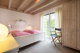 Ferienhaus in Sierksdorf - Pippis Ostsee-Traum - Schlafzimmer mit Doppeltbett im Obergeschoss