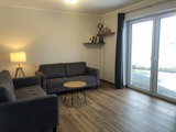 Ferienhaus in Fehmarn OT Gammendorf - Feriendomizil SeeSand - offener Wohnbereich mit Blick auf die Terrasse