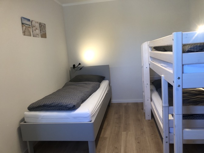 Ferienhaus in Fehmarn OT Gammendorf - Feriendomizil SeeSand 2 - Schlafzimmer mit Etagenbett und Einzelbett